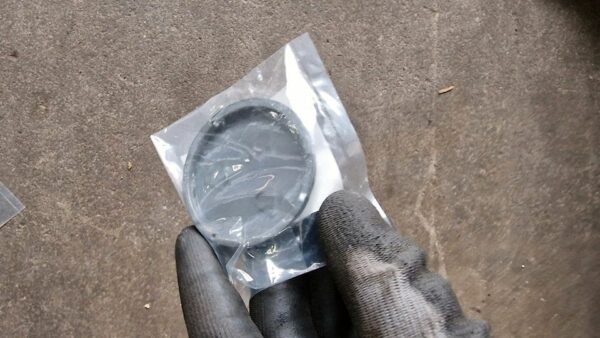 Original Mitsubishi Evo 6 TME Nabendeckel + Halter – Bild 2
